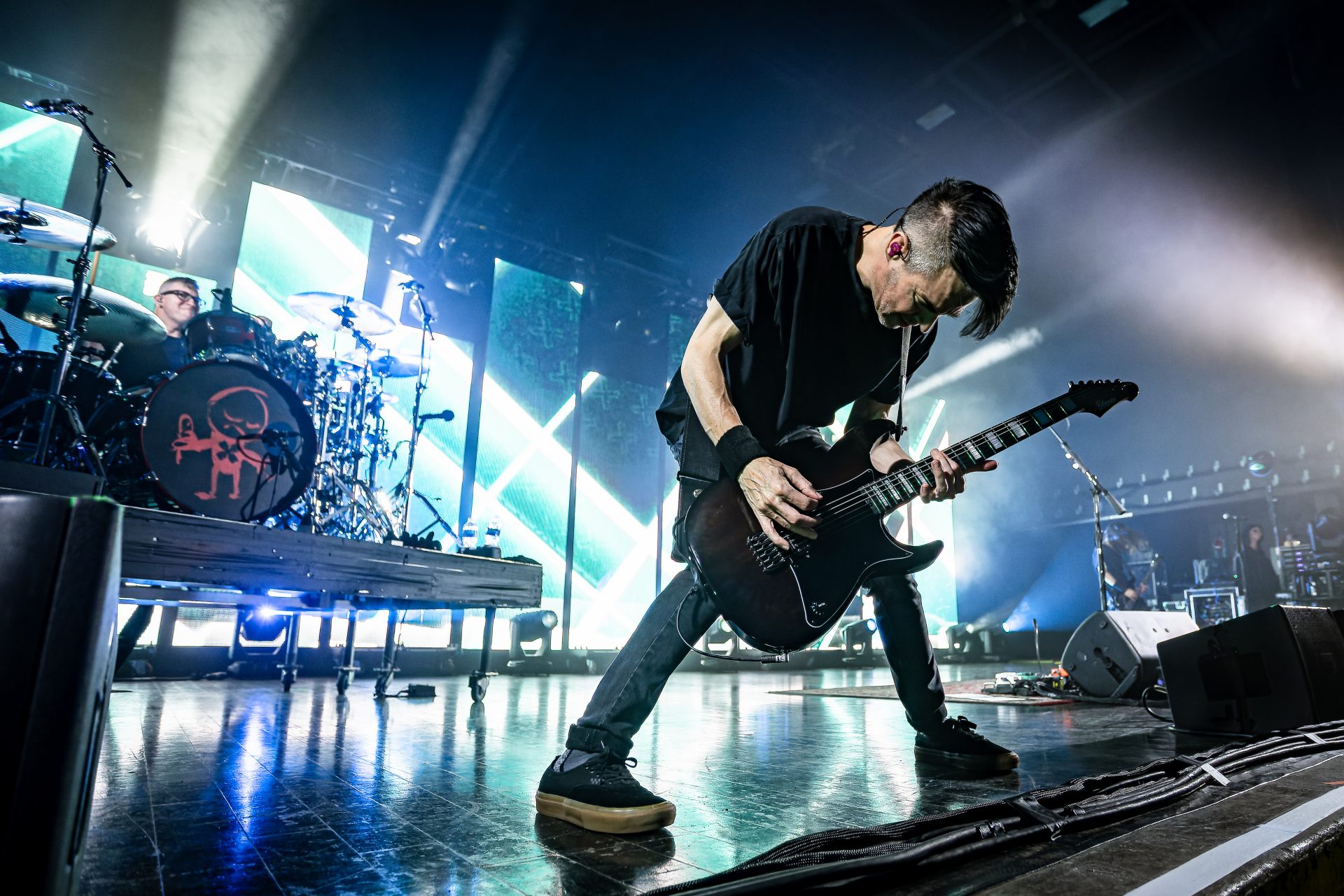 Chevelle performing live with electric guitars on stage
